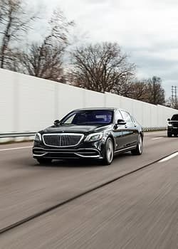 Black Mercedes-Benz S-Class sedan on highway